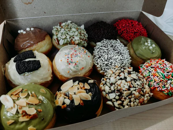 Assortment of donuts of different flavors in a box