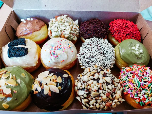 Assortment of donuts of different flavors in a box