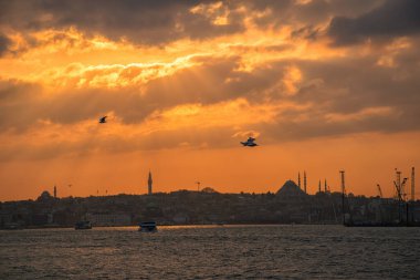Hagia Sophia, Topkapi Palace and Blue Mosque on sunset in Istanbul. View from a cloudy day in Istanbul
