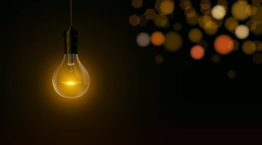 Bokeh ile koyu siyah arkaplan üzerinde ampul.