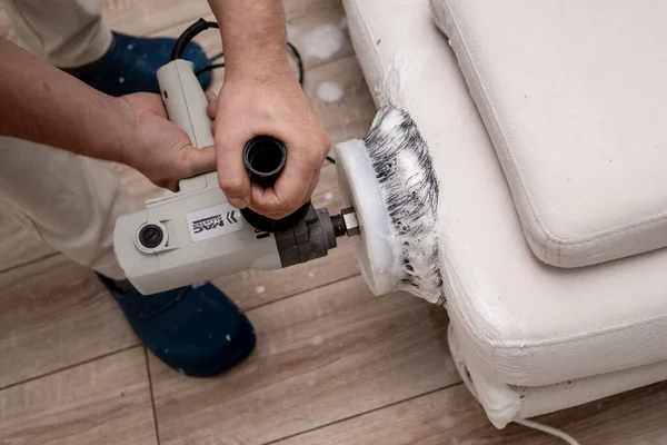 Cleaning a dirty sofa with a sofa washer