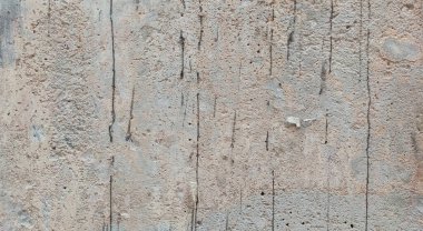 Gri beton duvar dokusu, beyaz alçılı duvar dokusu veya arka plan, dağınık sokak duvarı.