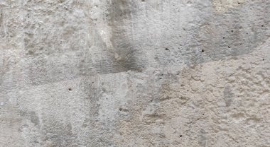 Gri beton duvar dokusu, beyaz alçılı duvar dokusu veya arka plan, dağınık sokak duvarı.
