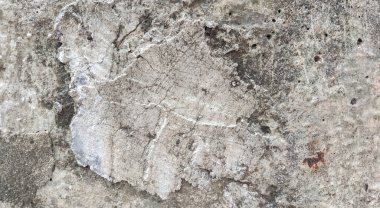 Gri beton duvar dokusu, beyaz alçılı duvar dokusu veya arka plan, dağınık sokak duvarı.
