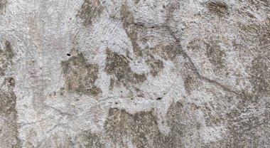 Gri beton duvar dokusu, beyaz alçılı duvar dokusu veya arka plan, dağınık sokak duvarı.