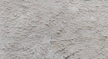 Gri beton duvar dokusu, beyaz alçılı duvar dokusu veya arka plan, dağınık sokak duvarı.