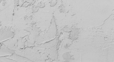 Gri beton duvar dokusu, beyaz alçılı duvar dokusu veya arka plan, dağınık sokak duvarı.