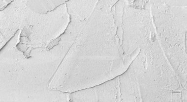 Gri beton duvar dokusu, beyaz alçılı duvar dokusu veya arka plan, dağınık sokak duvarı.