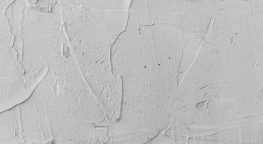 Gri beton duvar dokusu, beyaz alçılı duvar dokusu veya arka plan, dağınık sokak duvarı.