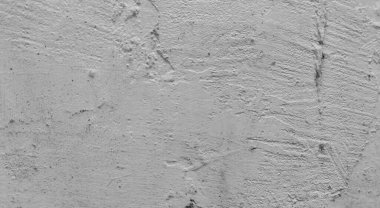 Gri beton duvar dokusu, beyaz alçılı duvar dokusu veya arka plan, dağınık sokak duvarı.