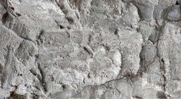 Gri beton duvar dokusu, beyaz alçılı duvar dokusu veya arka plan, dağınık sokak duvarı.