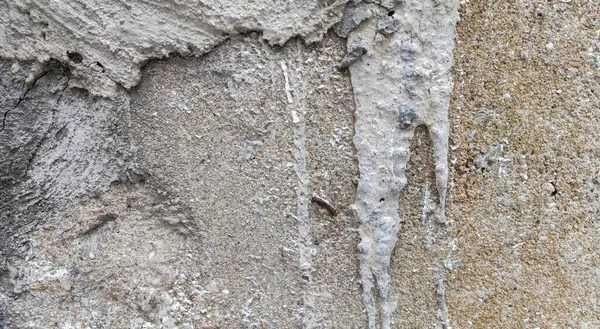 Gri beton duvar dokusu, beyaz alçılı duvar dokusu veya arka plan, dağınık sokak duvarı.