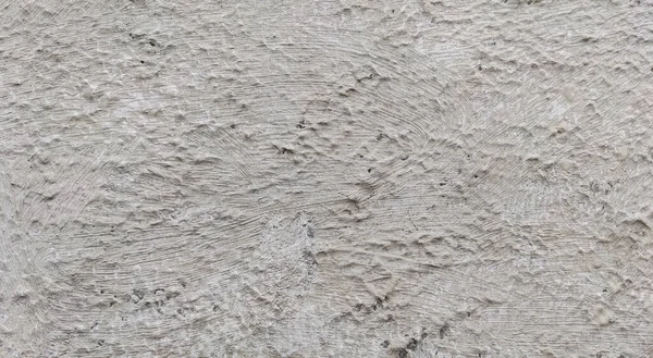 Gri beton duvar dokusu, beyaz alçılı duvar dokusu veya arka plan, dağınık sokak duvarı.