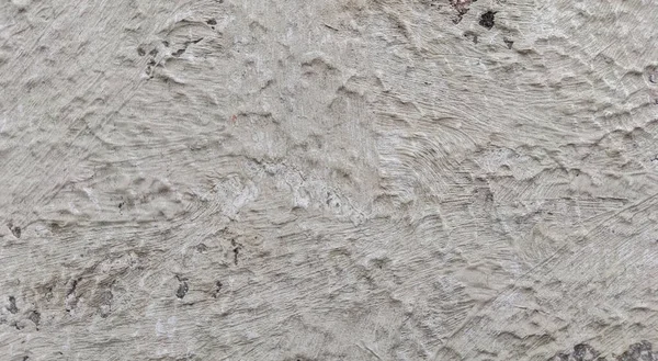 Gri beton duvar dokusu, beyaz alçılı duvar dokusu veya arka plan, dağınık sokak duvarı.