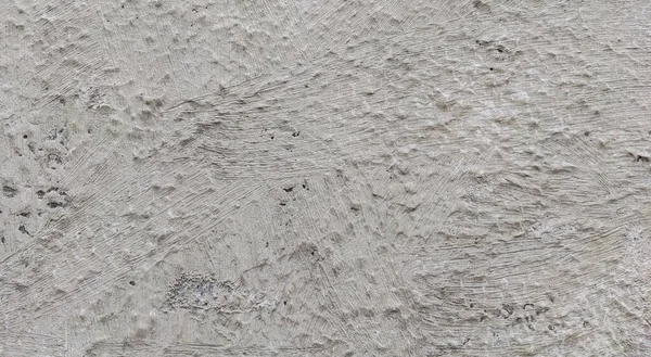 Gri beton duvar dokusu, beyaz alçılı duvar dokusu veya arka plan, dağınık sokak duvarı.