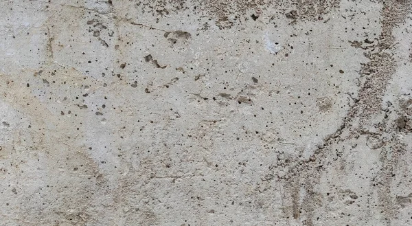 Gri beton duvar dokusu, beyaz alçılı duvar dokusu veya arka plan, dağınık sokak duvarı.