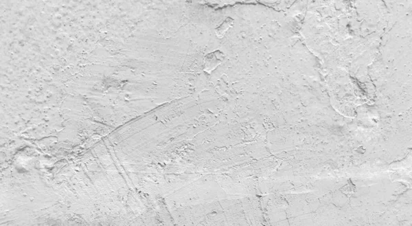 Gri beton duvar dokusu, beyaz alçılı duvar dokusu veya arka plan, dağınık sokak duvarı.