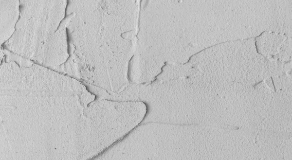 Gri beton duvar dokusu, beyaz alçılı duvar dokusu veya arka plan, dağınık sokak duvarı.