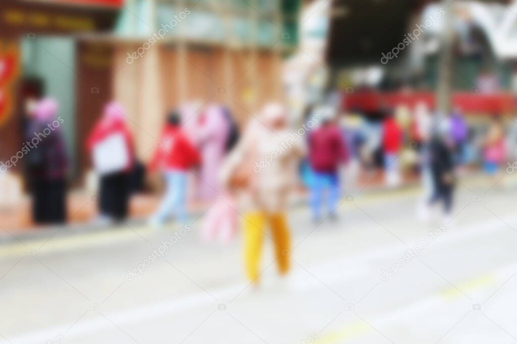 People at motion blur. Group of people walking open space. Defocused image