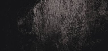 Duvar çiziklerle dolu. Arka plan için kirli çimento dokusu, korkutucu koyu duvar. Kara duvar.