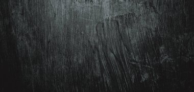 Duvar çiziklerle dolu. Arka plan için kirli çimento dokusu, korkutucu koyu duvar. Kara duvar.