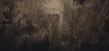 Duvar çiziklerle dolu. Arka plan için kirli çimento dokusu, korkutucu koyu duvar. Kara duvar.