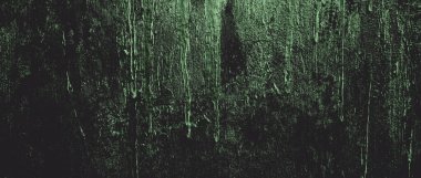 Duvar çiziklerle dolu. Arka plan için kirli çimento dokusu, korkutucu koyu duvar. Kara duvar.