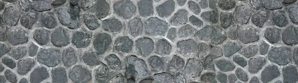 全景鹅卵石为背景 用石头砌成的旧砖墙 — 图库照片