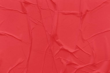 Boş kırmızı kağıt buruşmuş doku arkaplanıdır. Çeşitli amaçlar için buruşmuş kağıt dokusu altyapısı