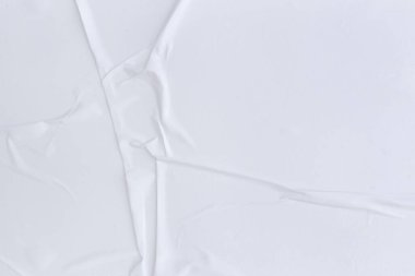 Boş beyaz kağıt buruşmuş doku arka planıdır. Çeşitli amaçlar için buruşmuş kağıt dokusu altyapısı