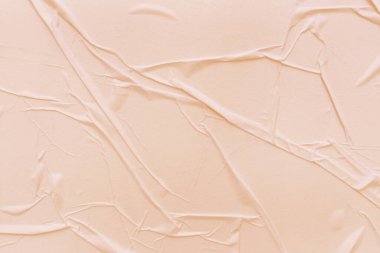 Boş krema kağıdı buruşmuş doku arka planıdır. Çeşitli amaçlar için buruşmuş kağıt dokusu altyapısı