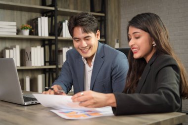 Business Asian people in formal outfit working together and brainstorming in modern office workplace.