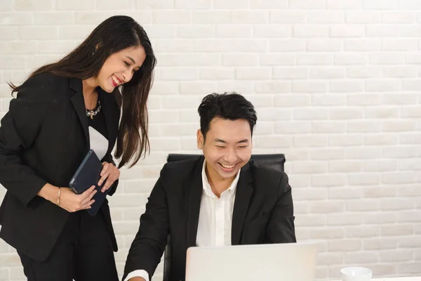 Business Asian people in formal outfit working together and brainstorming in modern office workplace.