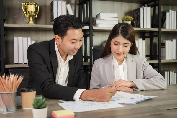 Business Asian people in formal outfit working together and brainstorming in modern office workplace.