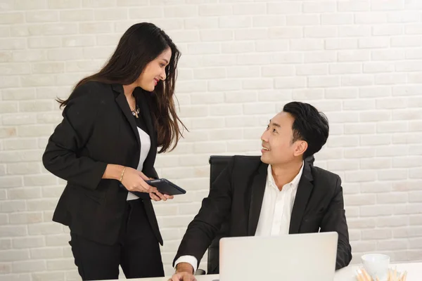 Business Asian people in formal outfit working together and brainstorming in modern office workplace.