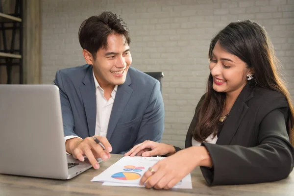 Business Asian people in formal outfit working together and brainstorming in modern office workplace.