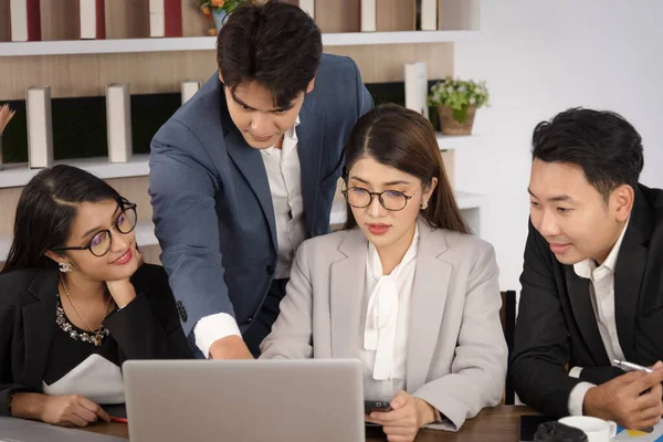 Business Asian people in formal suit meeting and working together in modern workspace.