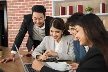Business Asian people in formal suit meeting and working together in modern workspace.