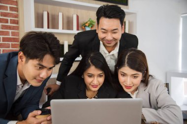 Business Asian people in formal suit meeting and working together in modern workspace.