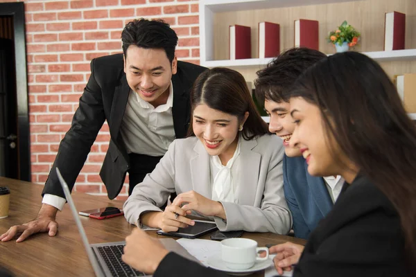 Business Asian people in formal suit meeting and working together in modern workspace.