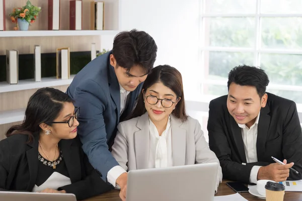 Business Asian people in formal suit meeting and working together in modern workspace.