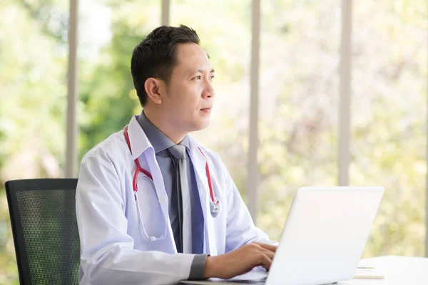 Asian Doctor Man White Professional Lab Coat Uniform Sitting Using — Stock Fotó