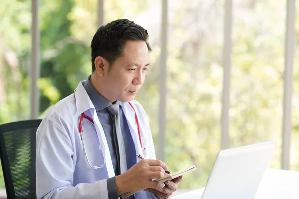 Asian Doctor Man White Professional Lab Coat Uniform Sitting Using — Stok fotoğraf