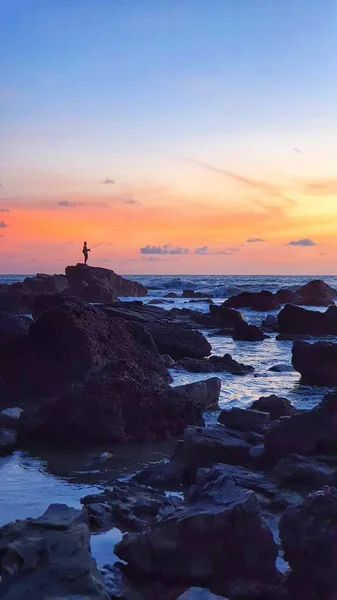Arambol, Goa 'da gün batımında balıkçı