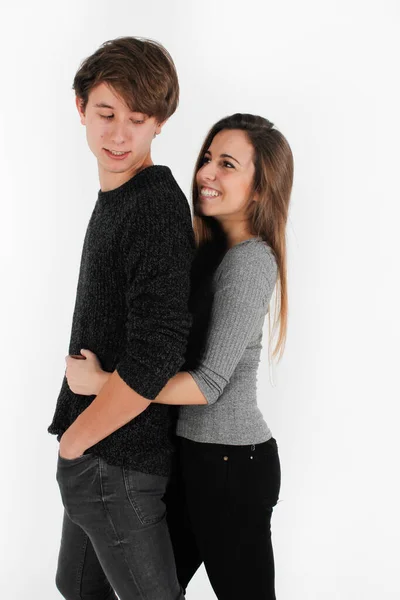 Young woman hugging her partner from behind while they smile — Fotografia de Stock