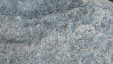 Doğal taşın dokuları ve arkaplanları çarpışıyor.