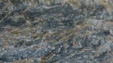 Doğal taşın dokuları ve arkaplanları çarpışıyor.