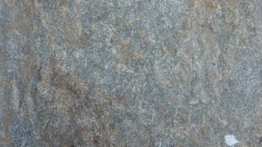 Doğal taşın dokuları ve arkaplanları çarpışıyor.