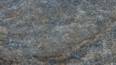 Doğal taşın dokuları ve arkaplanları çarpışıyor.