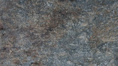 Doğal taşın dokuları ve arkaplanları çarpışıyor.